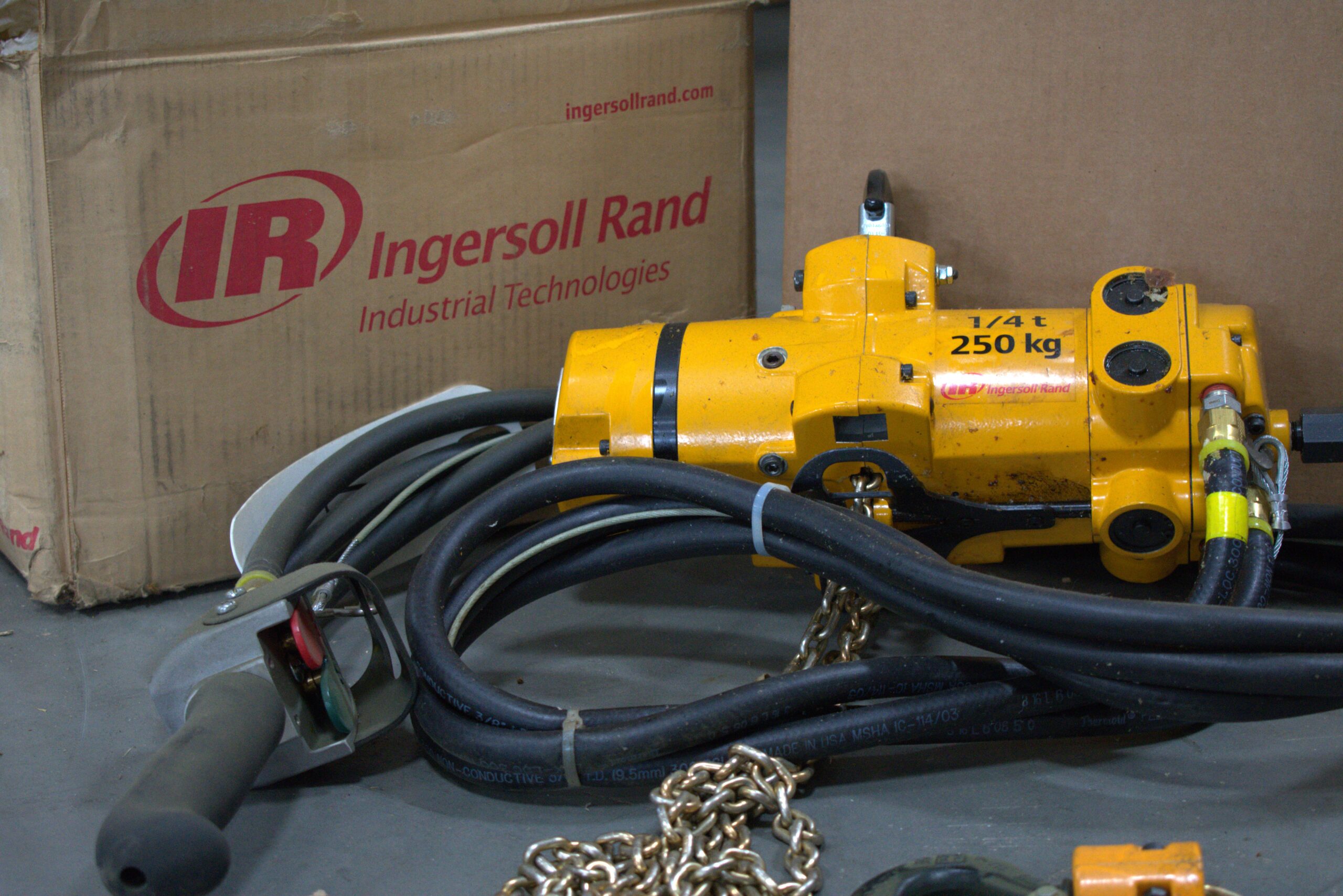 A custom lift assist tool designed for ergonomic handling.